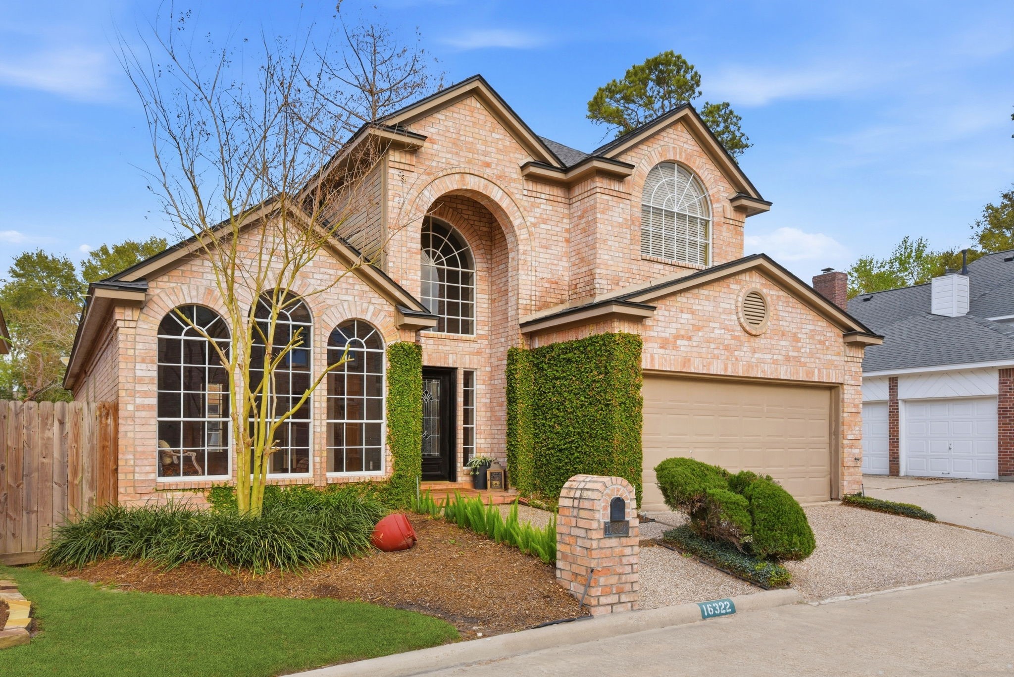 16322 Cranwood Drive Spring, TX 77379 - Photo 3 of 42 This stunning home boasts impressive windows that flood the interior with natural light, complemented by a beautifully manicured yard that enhances its curb appeal.