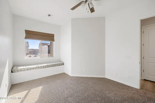 a living room with a bathtub and a chandelier