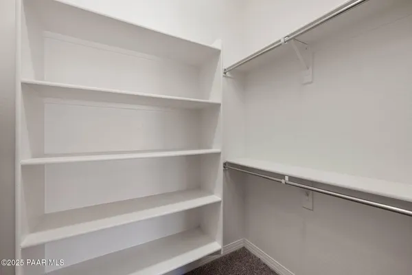 a view of an empty walk in closet