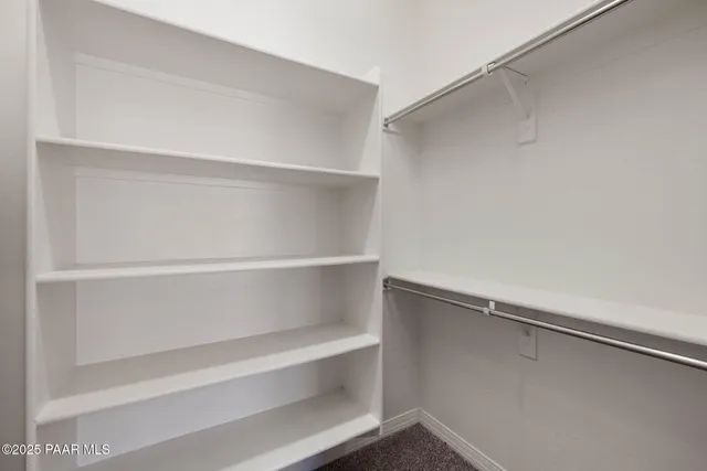 a view of an empty walk in closet