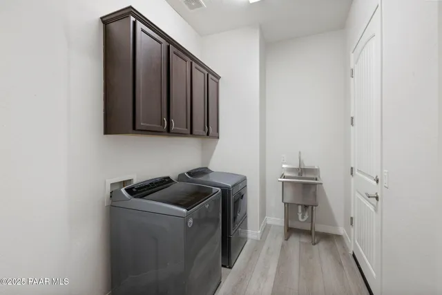 a utility room with cabinets