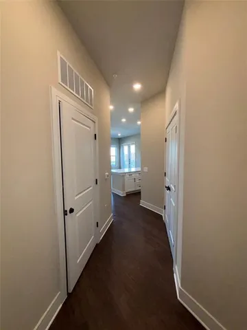 an empty room with wooden floor