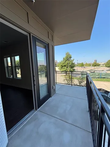 a view of a balcony with city view