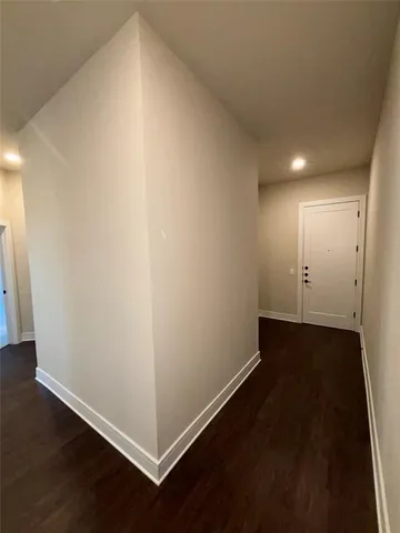 an empty room with wooden floor