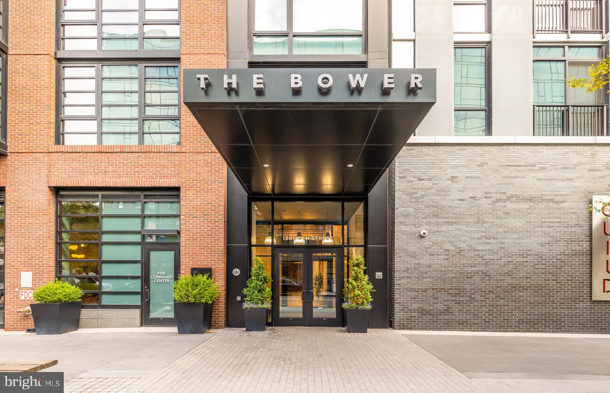 a front view of a building with outdoor seating