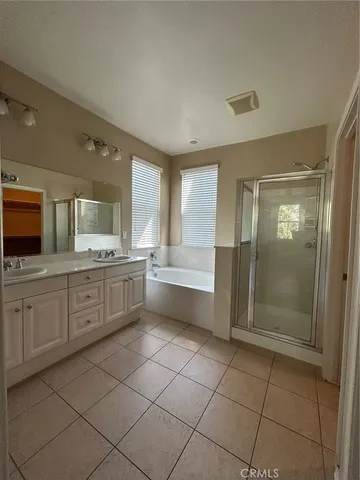 a large kitchen with a window and a sink