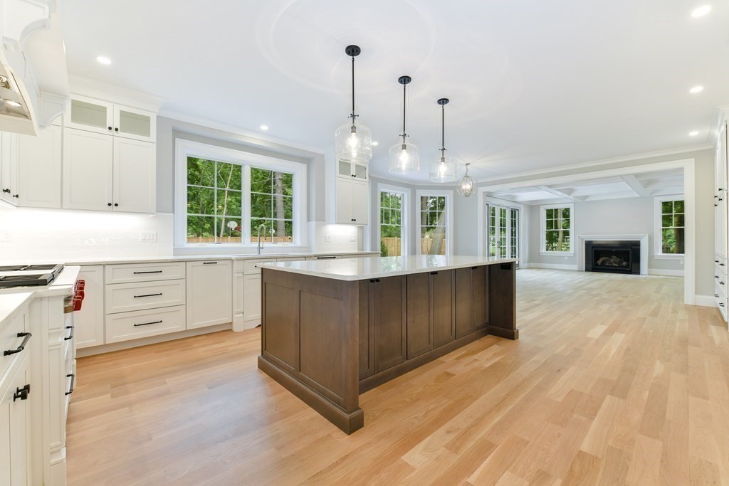 Lot 25 Leewood Road Wellesley, MA 02482 - Photo 16 of 40 a kitchen with granite countertop a stove a sink a center island and cabinets