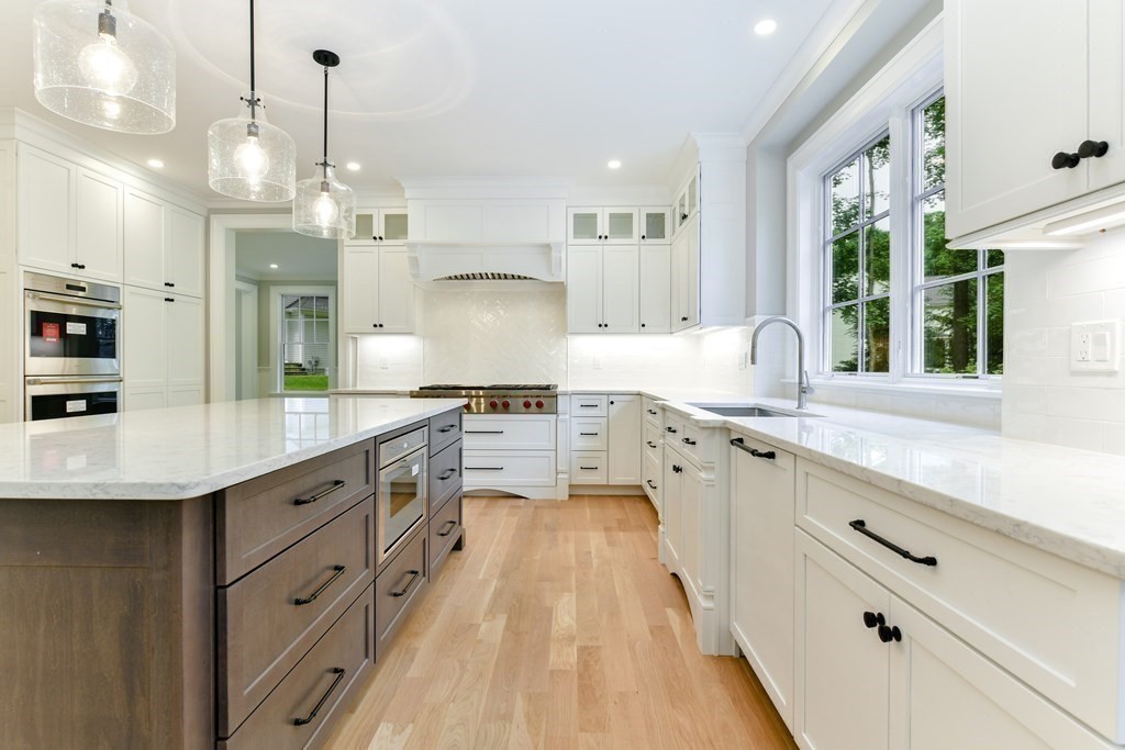 Lot 25 Leewood Road Wellesley, MA 02482 - Photo 18 of 40 a large kitchen with granite countertop a large white kitchen island and stainless steel appliances