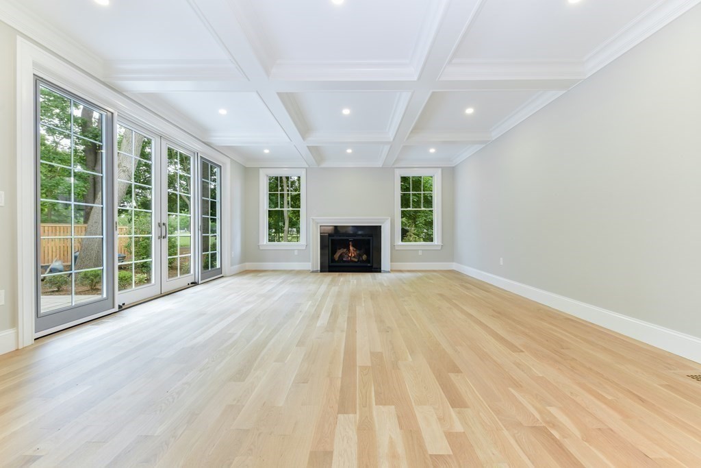 Lot 25 Leewood Road Wellesley, MA 02482 - Photo 23 of 40 a view of empty room with wooden floor and fireplace