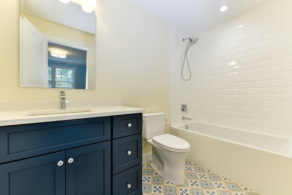 Lot 25 Leewood Road Wellesley, MA 02482 - Photo 33 of 40 a bathroom with a sink a toilet and shower