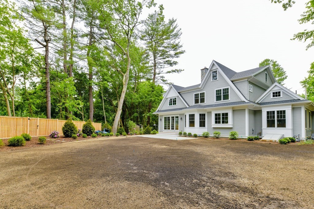 Lot 25 Leewood Road Wellesley, MA 02482 - Photo 5 of 40 a front view of a house with a yard and trees