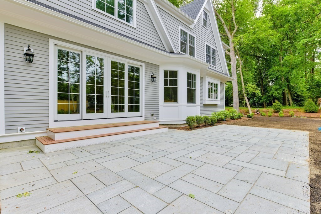 Lot 25 Leewood Road Wellesley, MA 02482 - Photo 6 of 40 a view of a brick house with a large window and yard