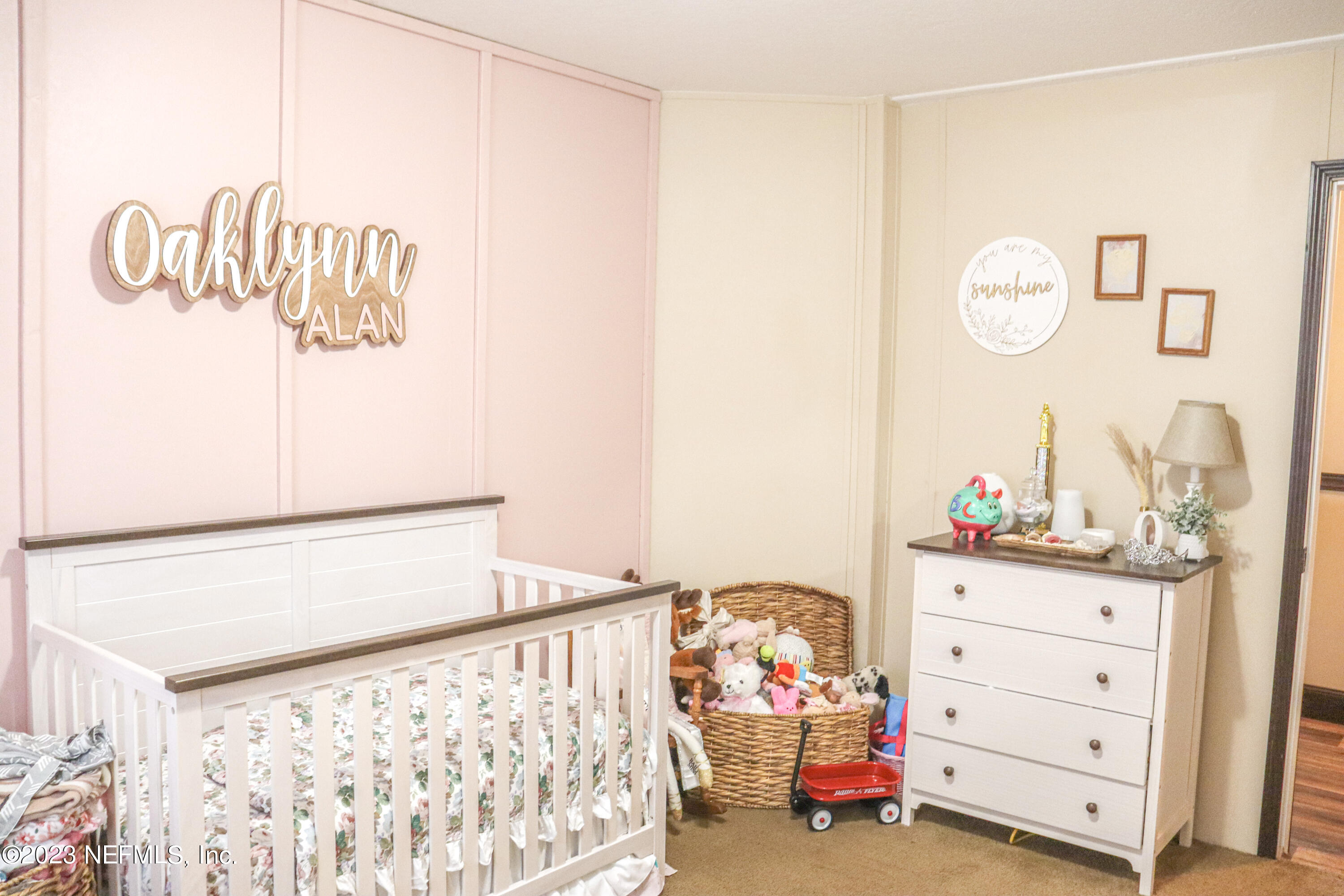 447689 Us Highway Callahan, FL 32011 - Photo 14 of 37 a bedroom with a bed and a dresser in it
