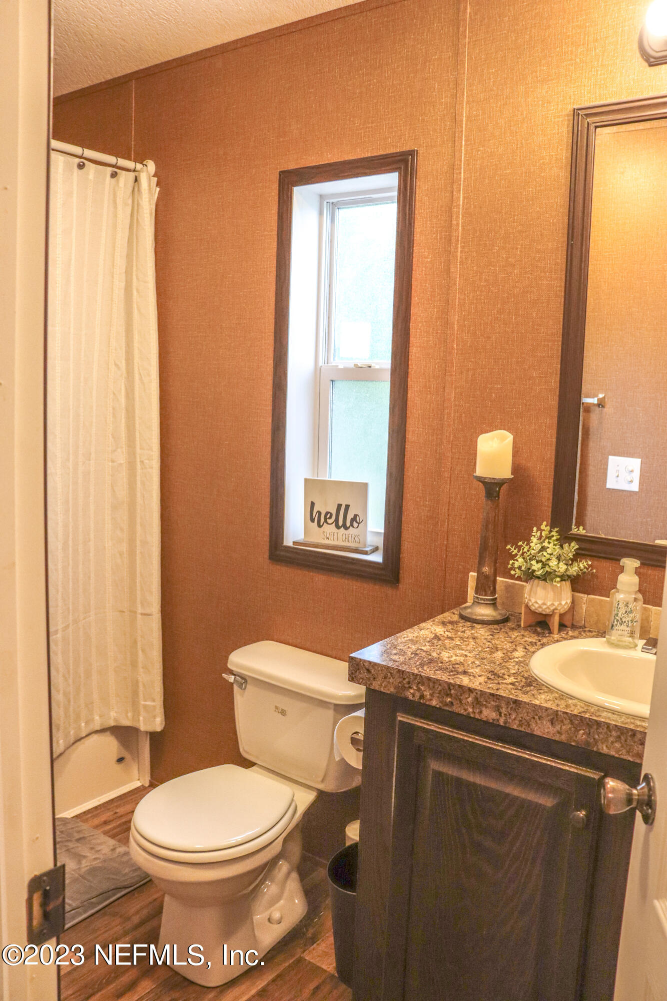 447689 Us Highway Callahan, FL 32011 - Photo 17 of 37 a bathroom with a sink toilet and mirror