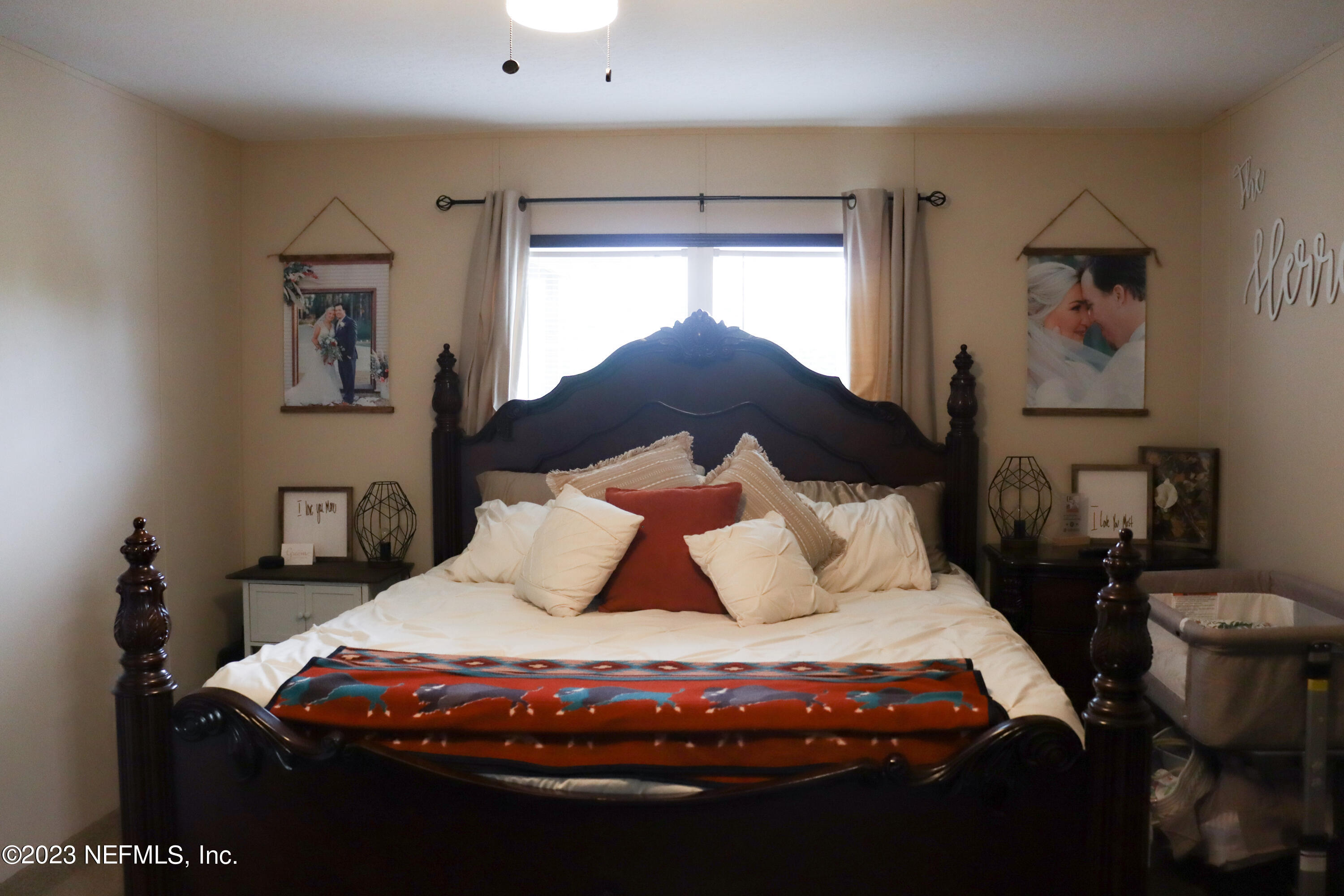 447689 Us Highway Callahan, FL 32011 - Photo 18 of 37 a bedroom with a bed and window