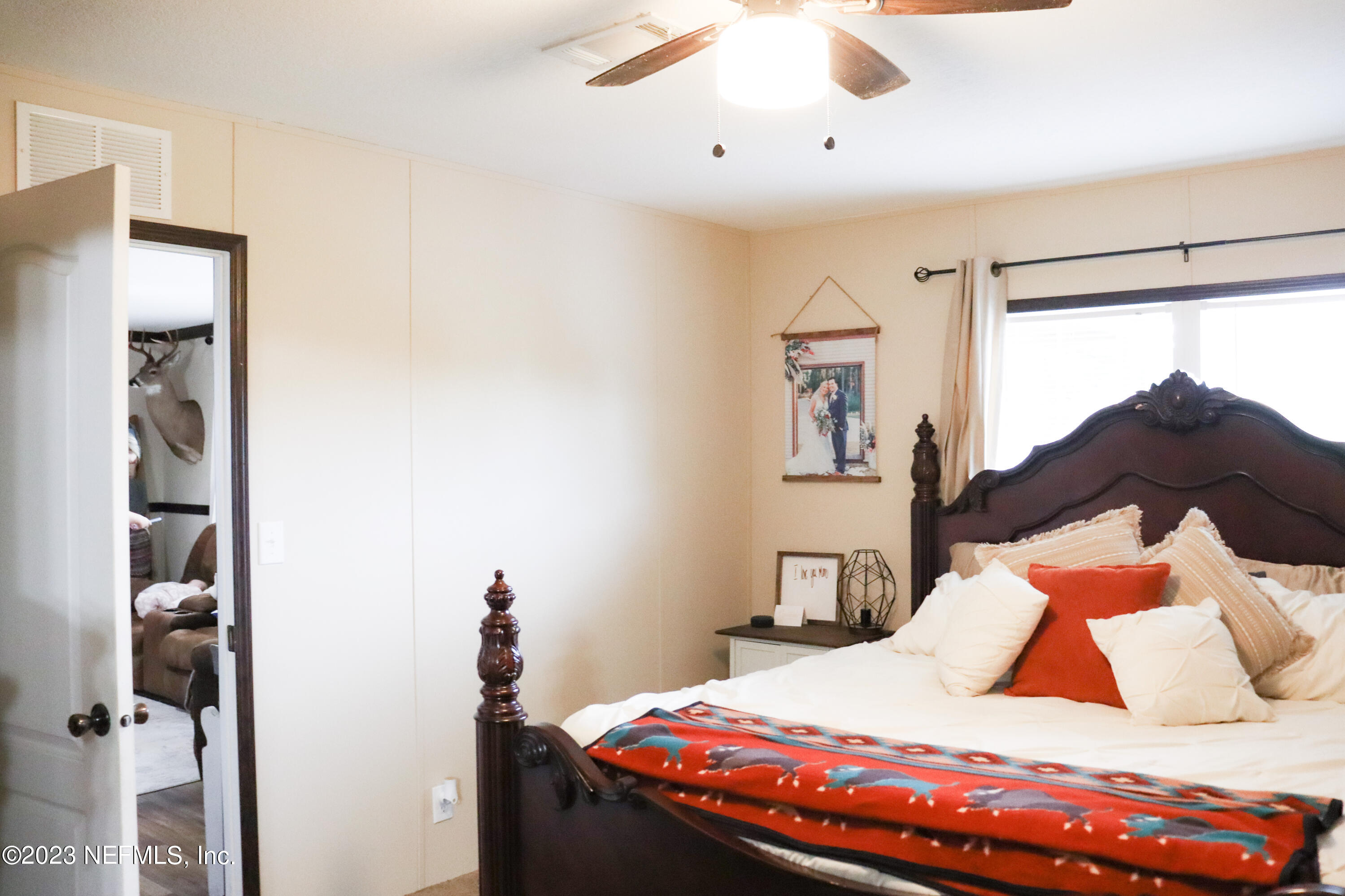 447689 Us Highway Callahan, FL 32011 - Photo 19 of 37 a bedroom with a bed and a window