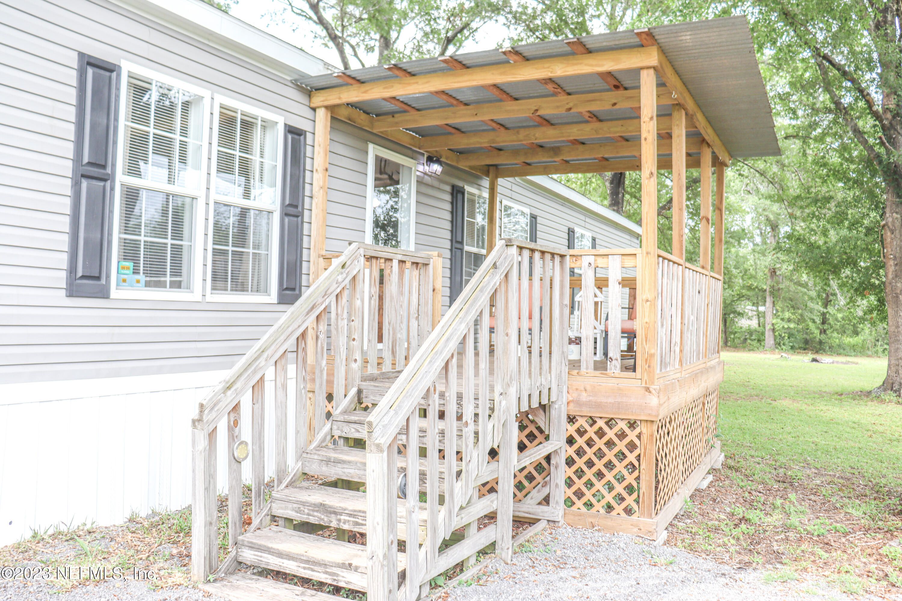 447689 Us Highway Callahan, FL 32011 - Photo 26 of 37 a view of wooden house with a large windows