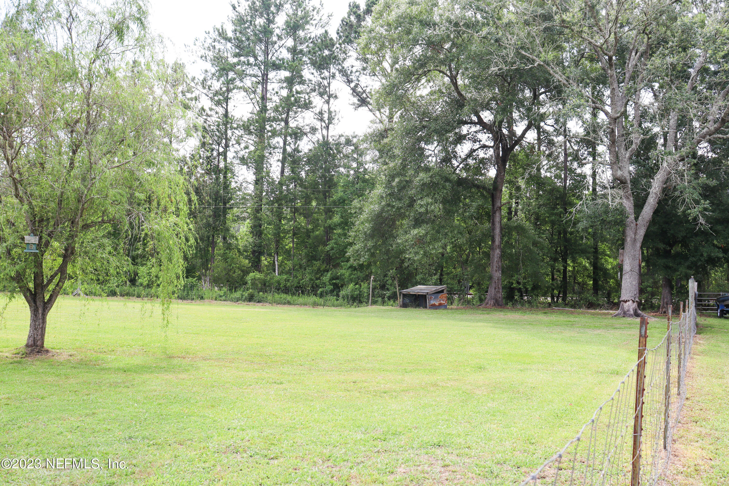 447689 Us Highway Callahan, FL 32011 - Photo 29 of 37 a view of a field with trees in the background
