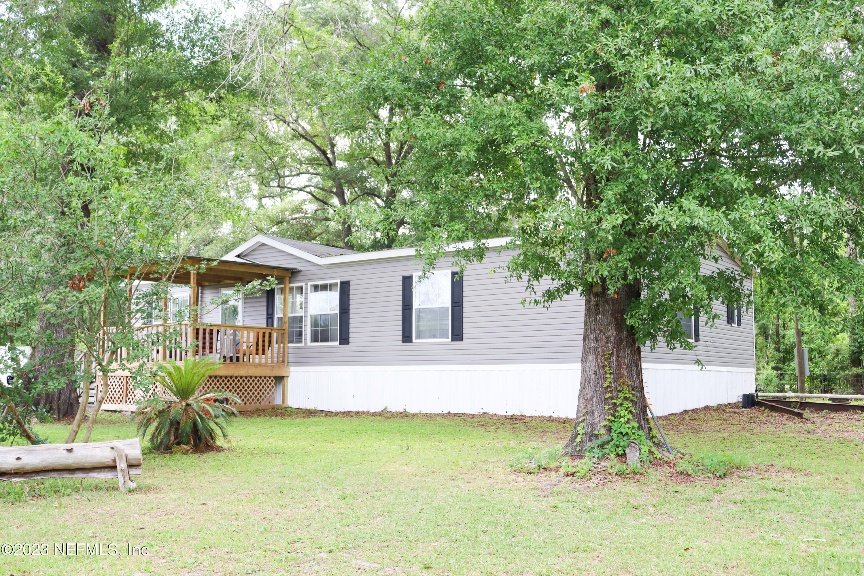 447689 Us Highway Callahan, FL 32011 - Photo 31 of 37 a front view of house with yard and trees