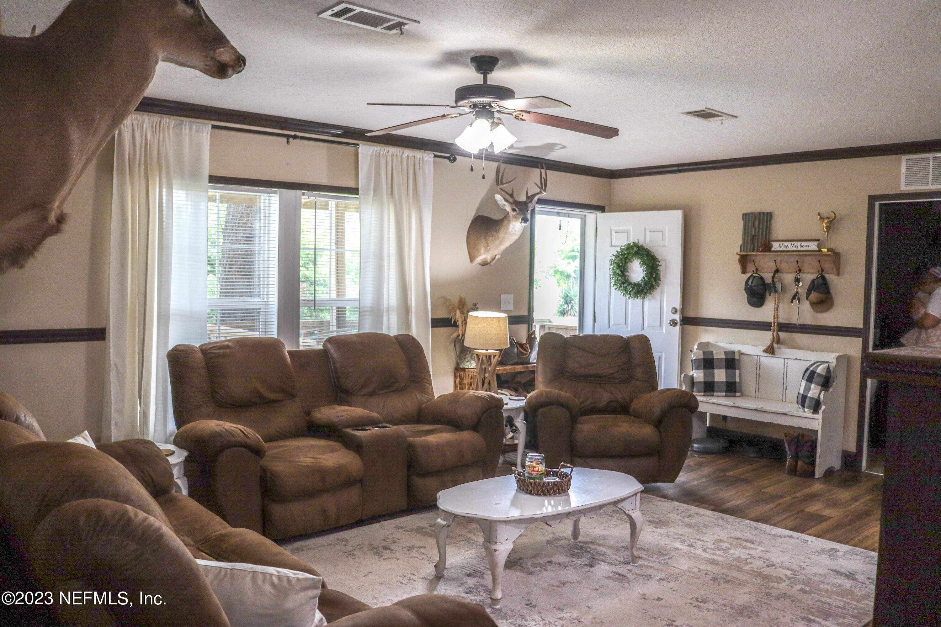 447689 Us Highway Callahan, FL 32011 - Photo 9 of 37 a living room with furniture kitchen view and a large window