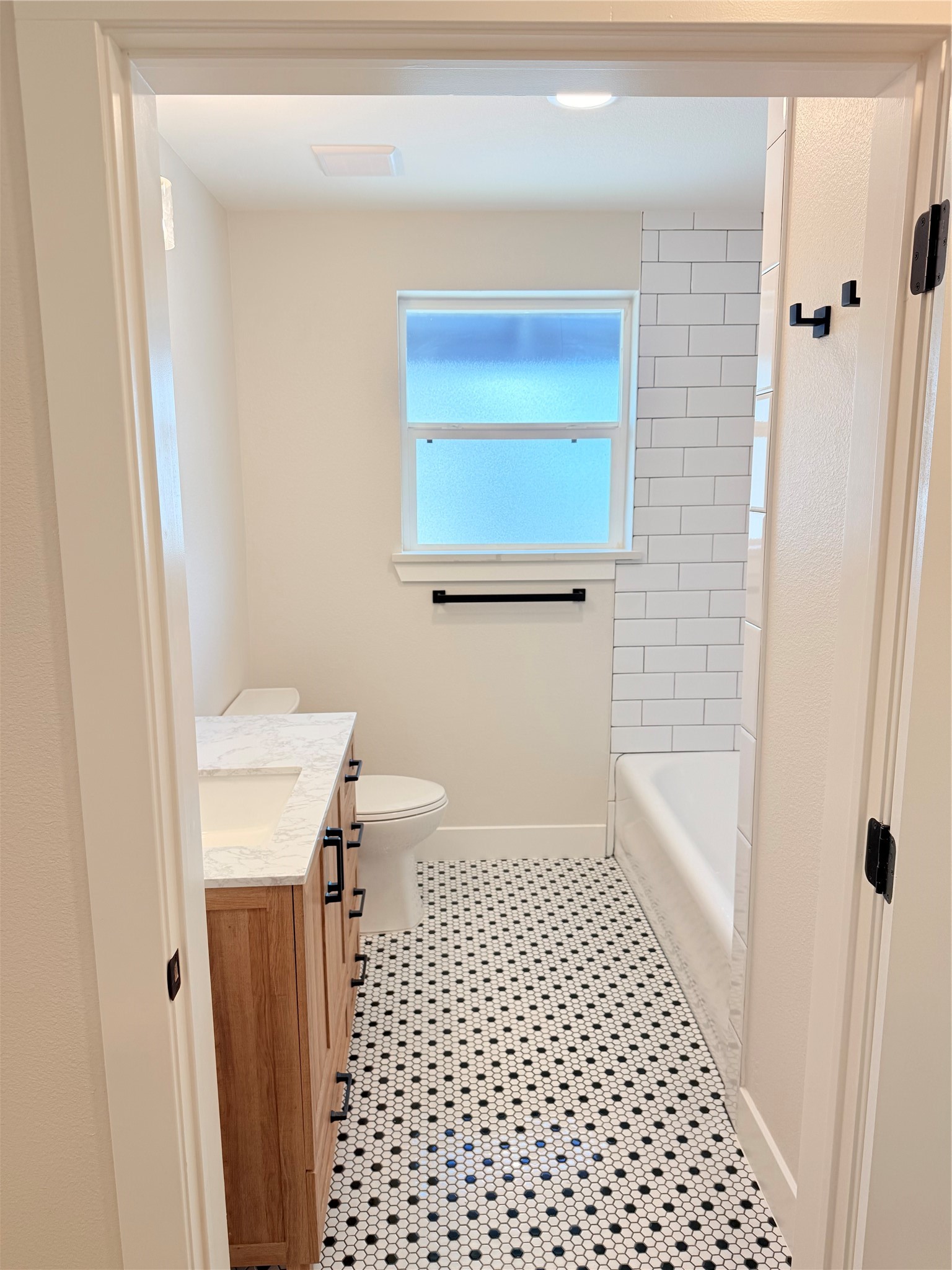 2001 Brun Street, Unit 1 Houston, TX 77019 - Photo 7 of 15 a bathroom with a sink a toilet a window and shower