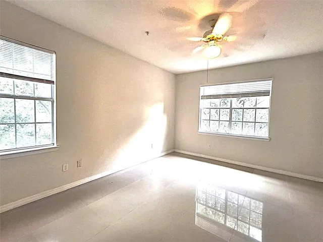a view of an empty room and a window