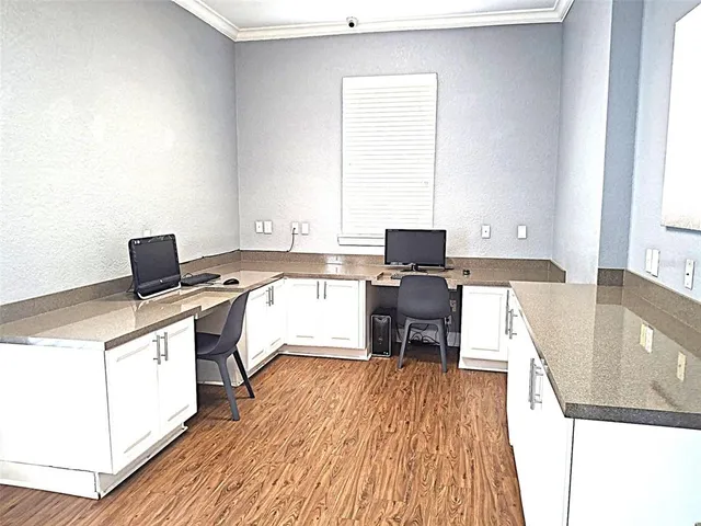 a view of a chairs and table in the patio