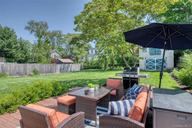 a view of yard with seating area and garden