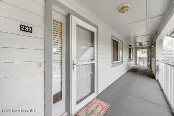 a view of a hallway with windows