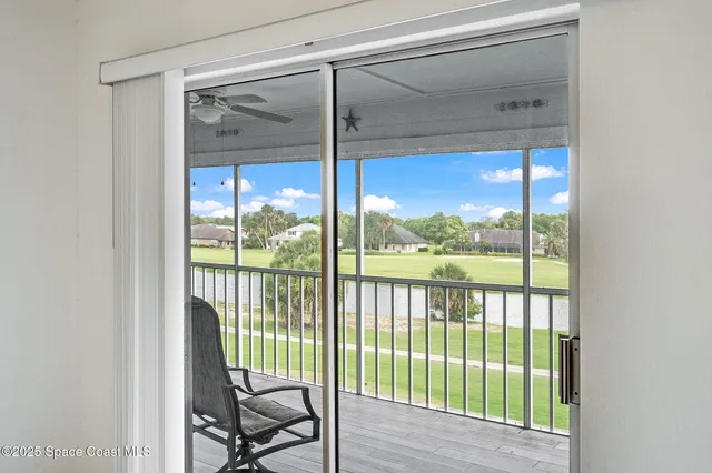 a view of a room with a large window