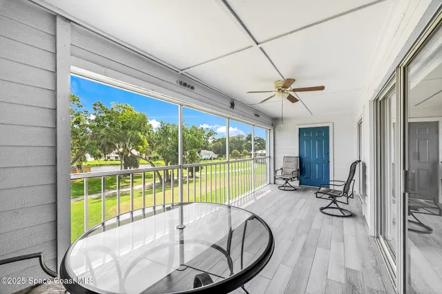 a view of a living room and a wooden floor