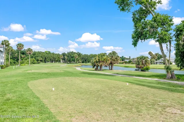a view of a golf course with a lake