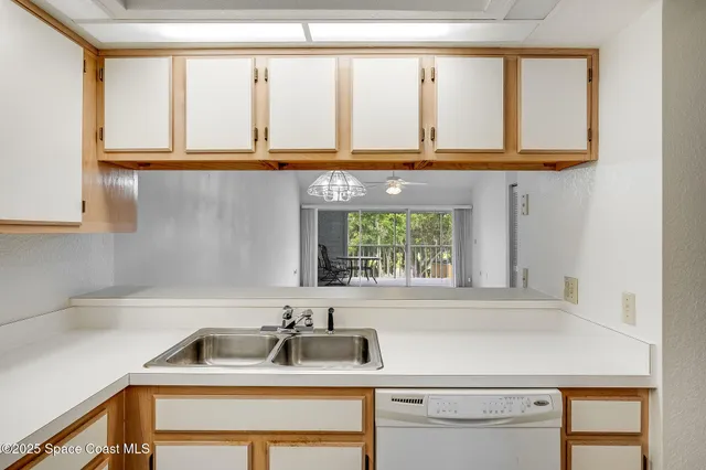 a kitchen with a sink and a window