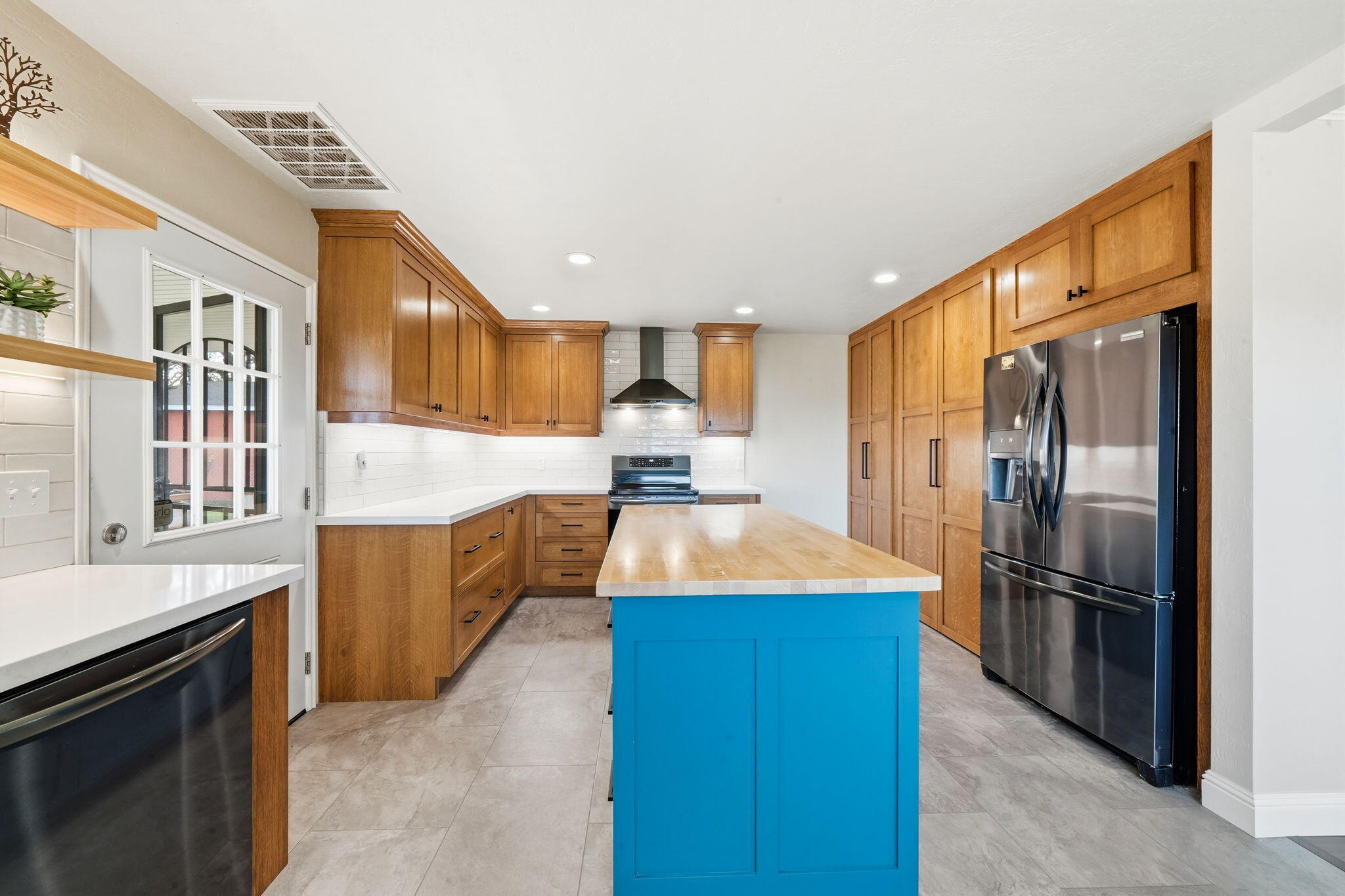 19690 Harp Road Cottonwood, CA 96022 - Photo 12 of 97 a large kitchen with stainless steel appliances kitchen island granite countertop a refrigerator and a stove top oven