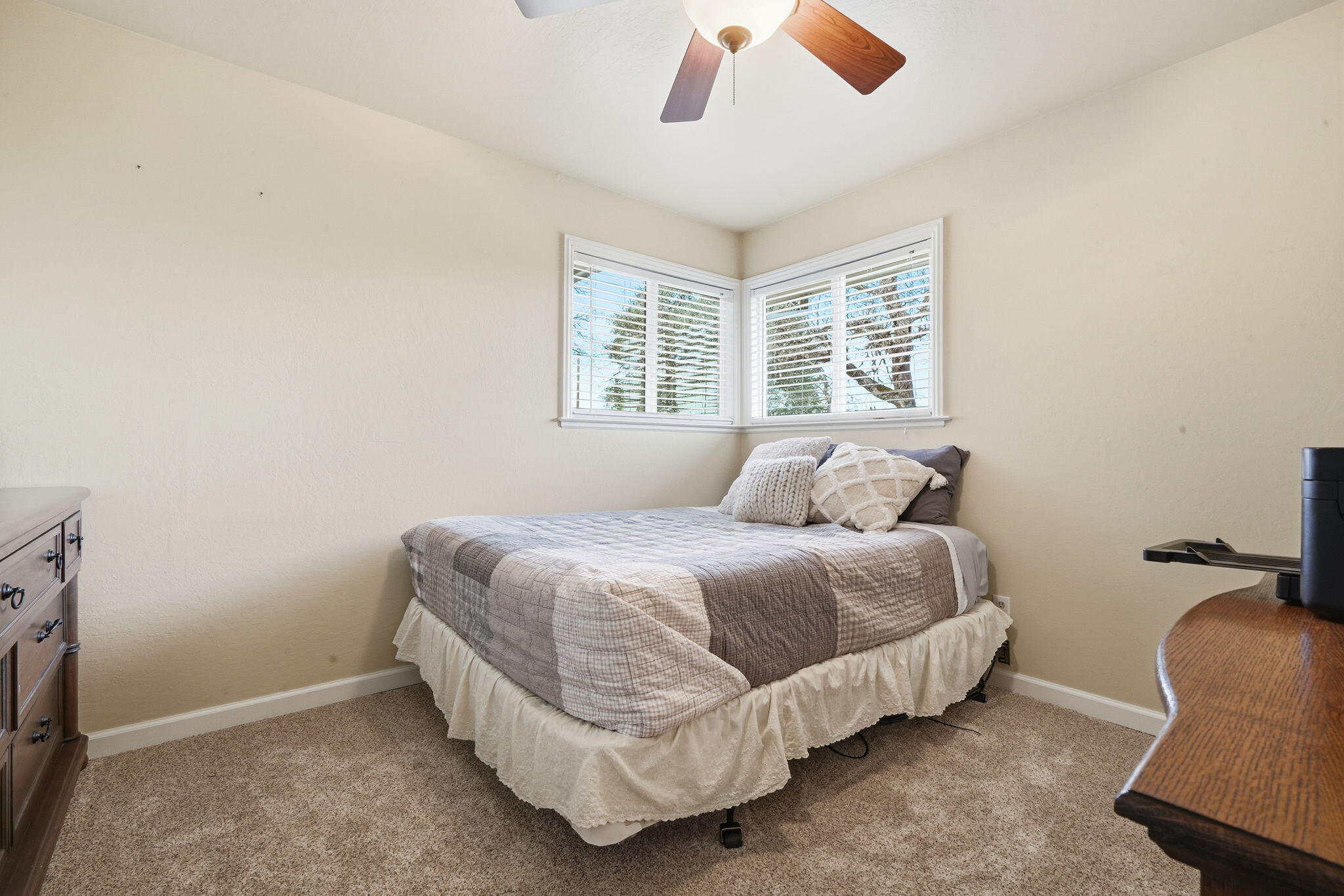 19690 Harp Road Cottonwood, CA 96022 - Photo 17 of 97 a bed sitting in a bedroom next to a window