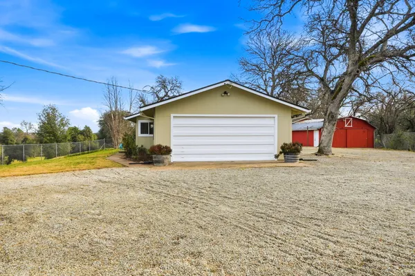 a view of a patio with a table and chairs