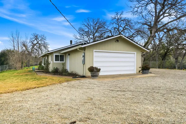 a view of a patio with a table chairs and a table