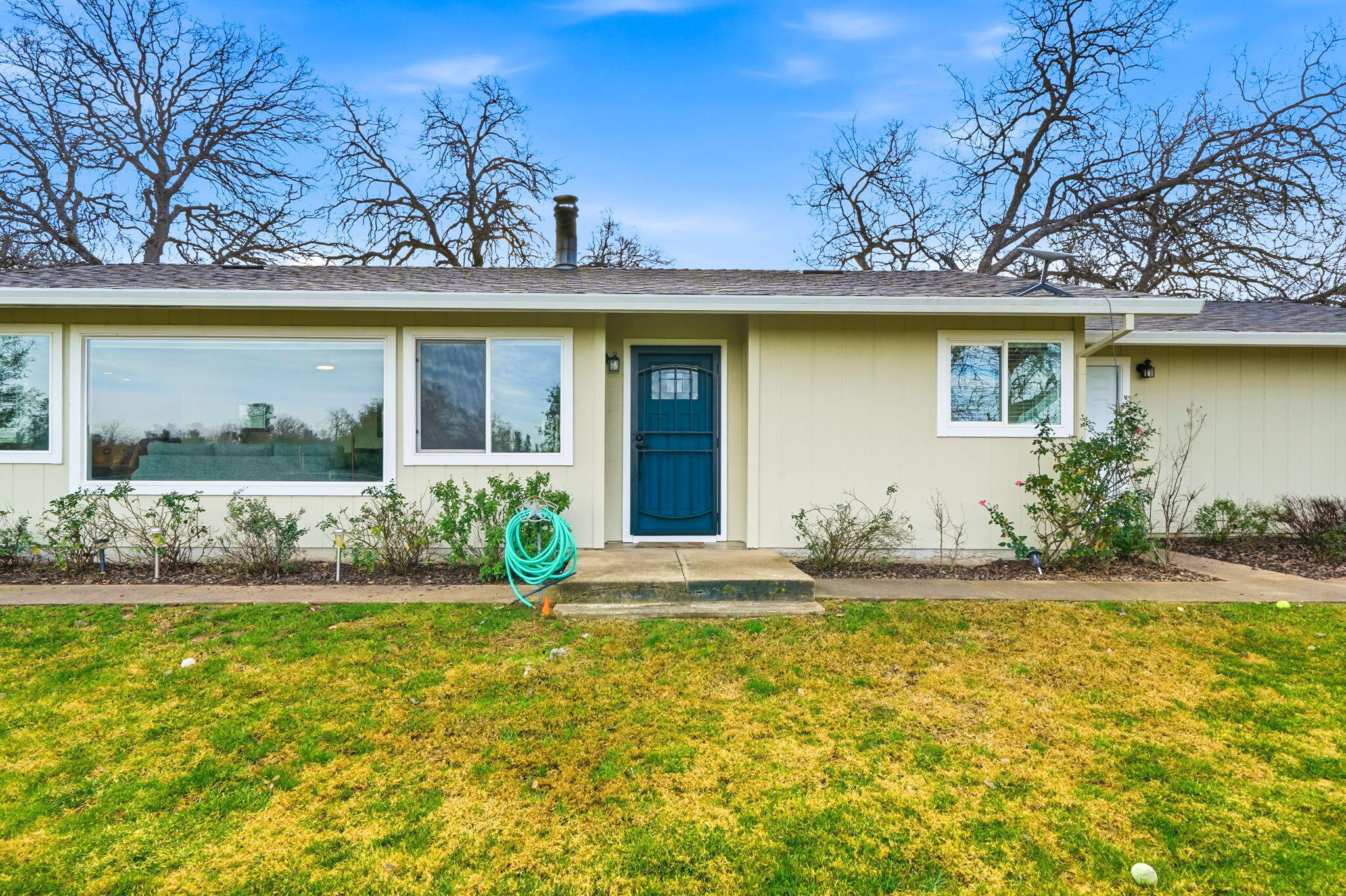 19690 Harp Road Cottonwood, CA 96022 - Photo 32 of 97 a view of a house with a large tree and a yard