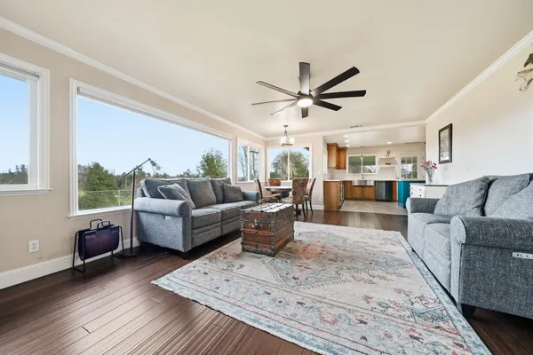 a view of yard with swimming pool and green space