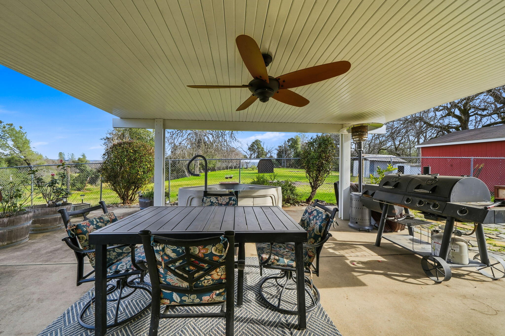 19690 Harp Road Cottonwood, CA 96022 - Photo 37 of 97 a view of a patio with a table chairs and a table