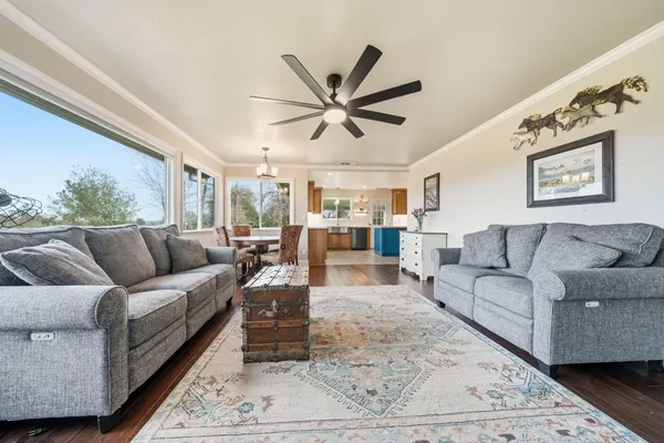 a kitchen with stainless steel appliances granite countertop a stove a sink a refrigerator and a microwave