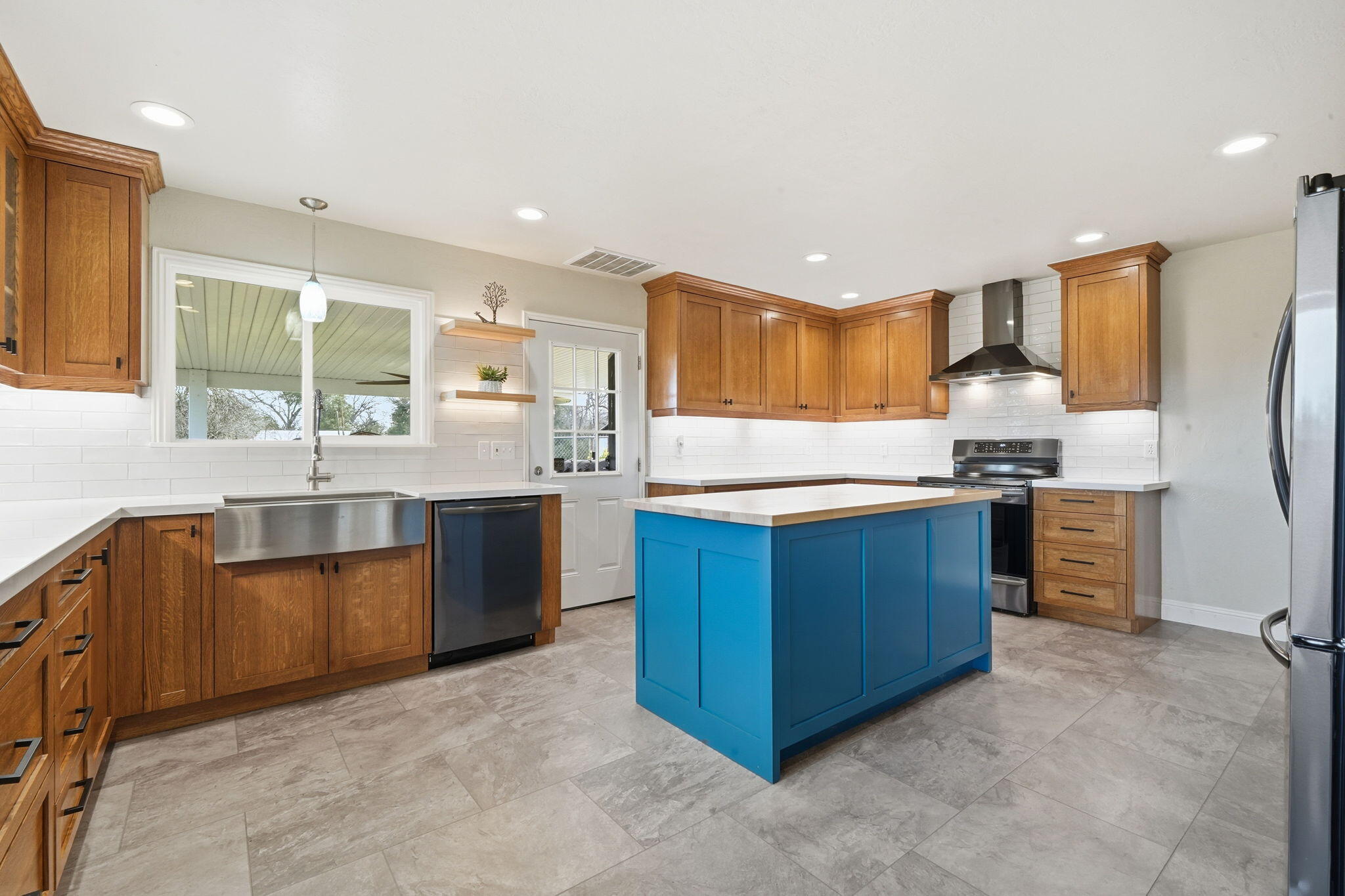 19690 Harp Road Cottonwood, CA 96022 - Photo 7 of 97 a kitchen with stainless steel appliances granite countertop a stove a sink a refrigerator and a microwave