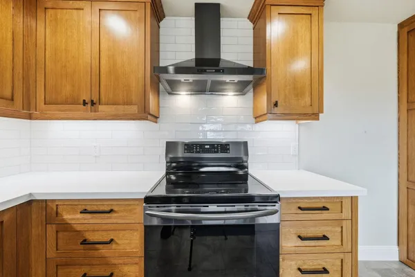 a spacious bathroom with a granite countertop sink and a large mirror