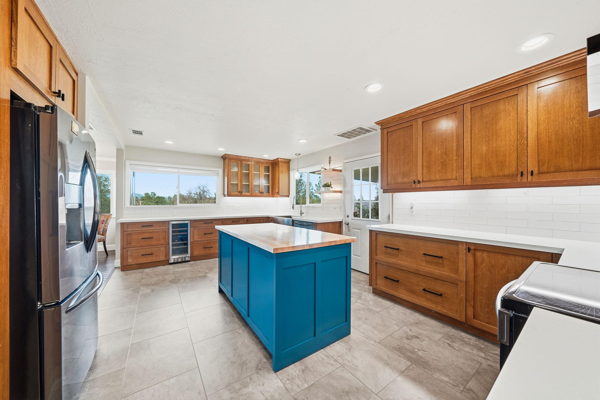 19690 Harp Road Cottonwood, CA 96022 - Photo 10 of 97 a kitchen with stainless steel appliances granite countertop a stove refrigerator and cabinets
