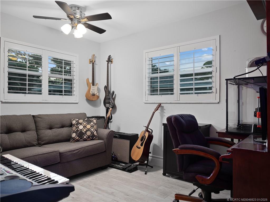 1544 Northwest Spruce Ridge Drive Stuart, FL 34994 - Photo 13 of 23 a work room with furniture and window