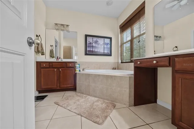 a bathroom with a bathtub and a sink
