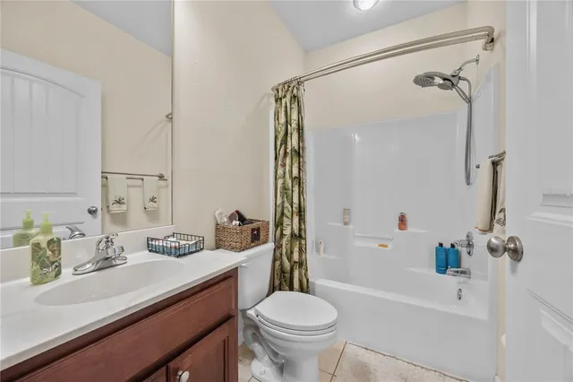a bathroom with a sink toilet tub and shower
