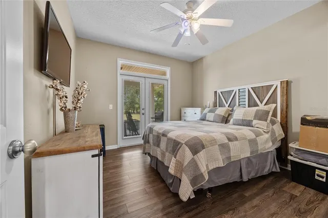 a bedroom with a bed and a chandelier