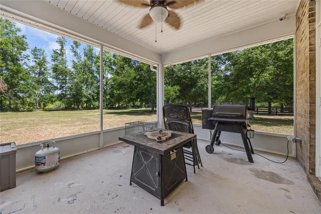 a view of a chairs and table in patio