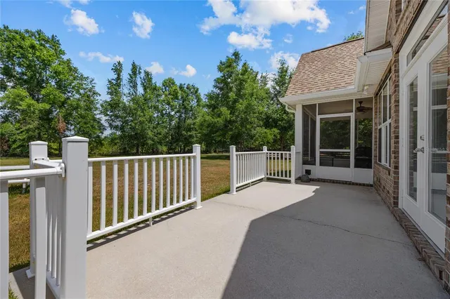 a view of a house with backyard and porch